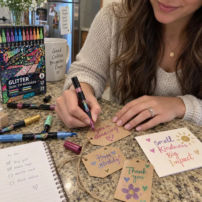Adult writing handmade gift tags and cards with glitter markers